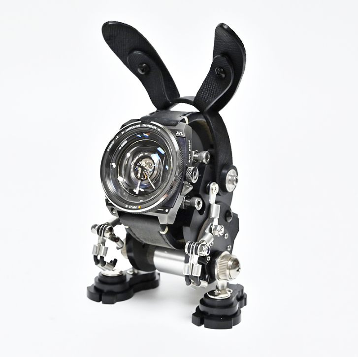 Black RoboRabbit watch stand with articulated ears and chrome mechanical details holding round-face timepiece