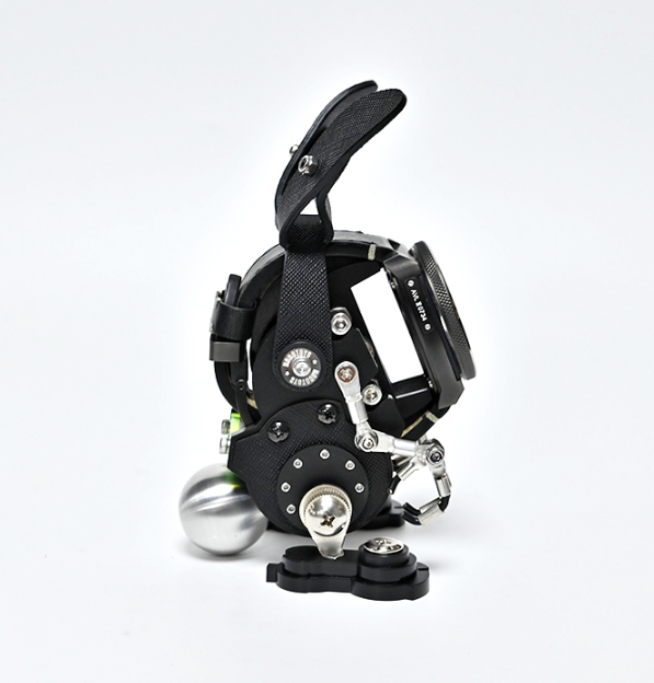 Black RoboRabbit robotic watch stand with articulated limbs, metallic accents, and spherical feet on white background