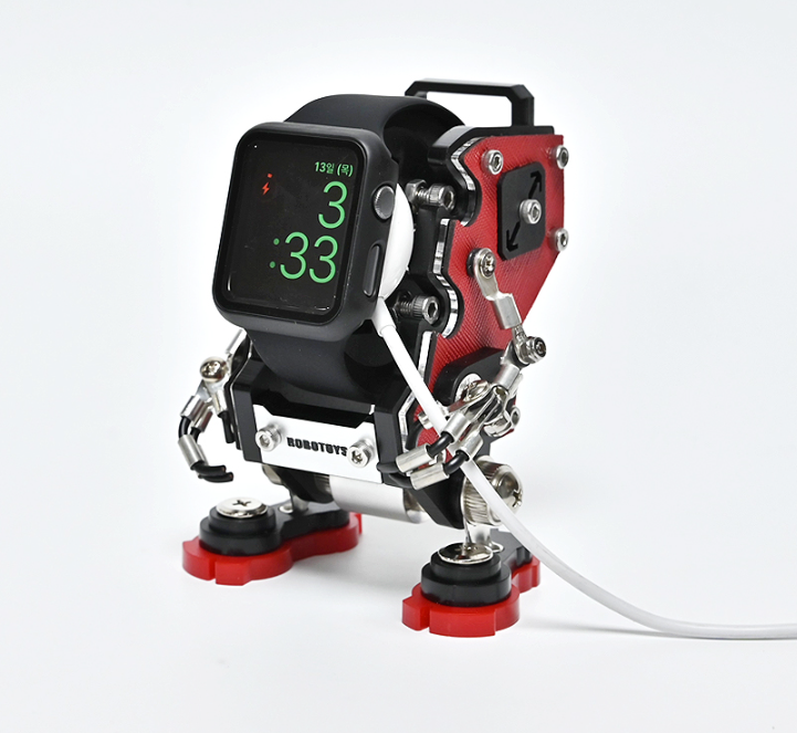 RoboToys NanoBot red smartwatch stand with mechanical arms and charging cable attached