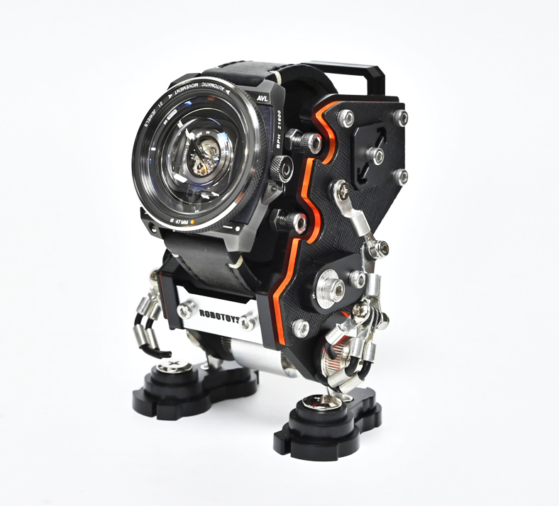 Black NanoBot robot watch stand with orange accents and articulated joints displaying analog watch