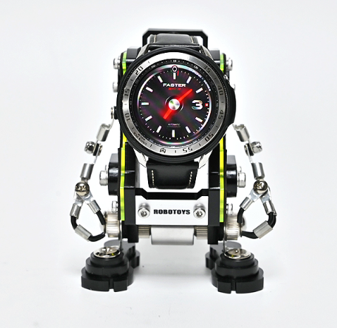 Black sports watch with red accents mounted on silver and neon yellow robotic stand with articulated arms and legs