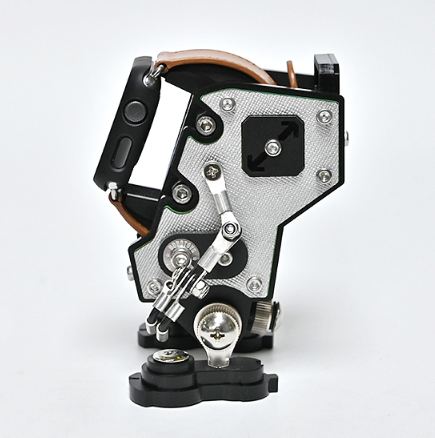 Silver NanoBot mechanical watch stand with black accents and exposed gear details