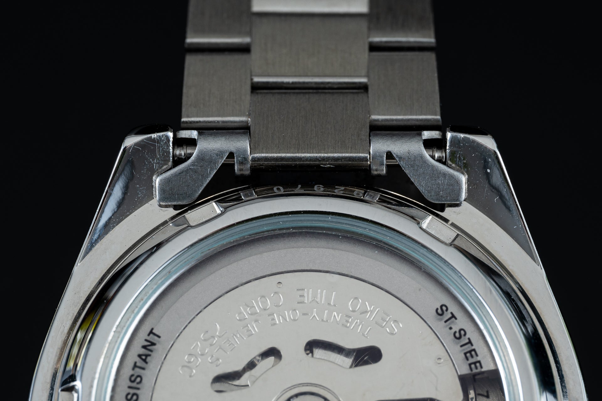 Seiko 5 SNKL automatic watch stainless steel bracelet and caseback detail with brushed metal finish
