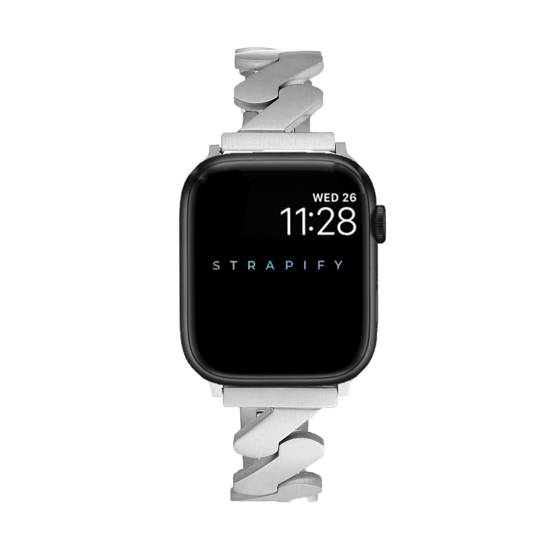 Black Apple Watch with silver jagged link bracelet, displaying time 11:28 on Wednesday 26
