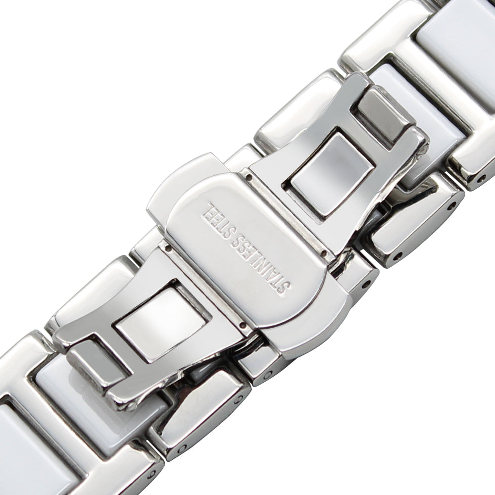 Silver and white ceramic bracelet with quick release deployment clasp and stainless steel links, overhead view