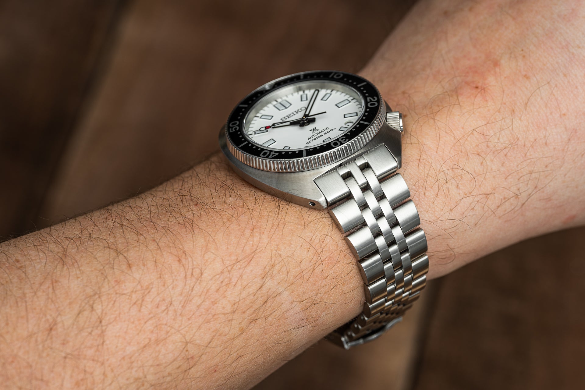 Seiko SPB31x Slim Turtle automatic watch with white dial and stainless steel jubilee bracelet worn on wrist