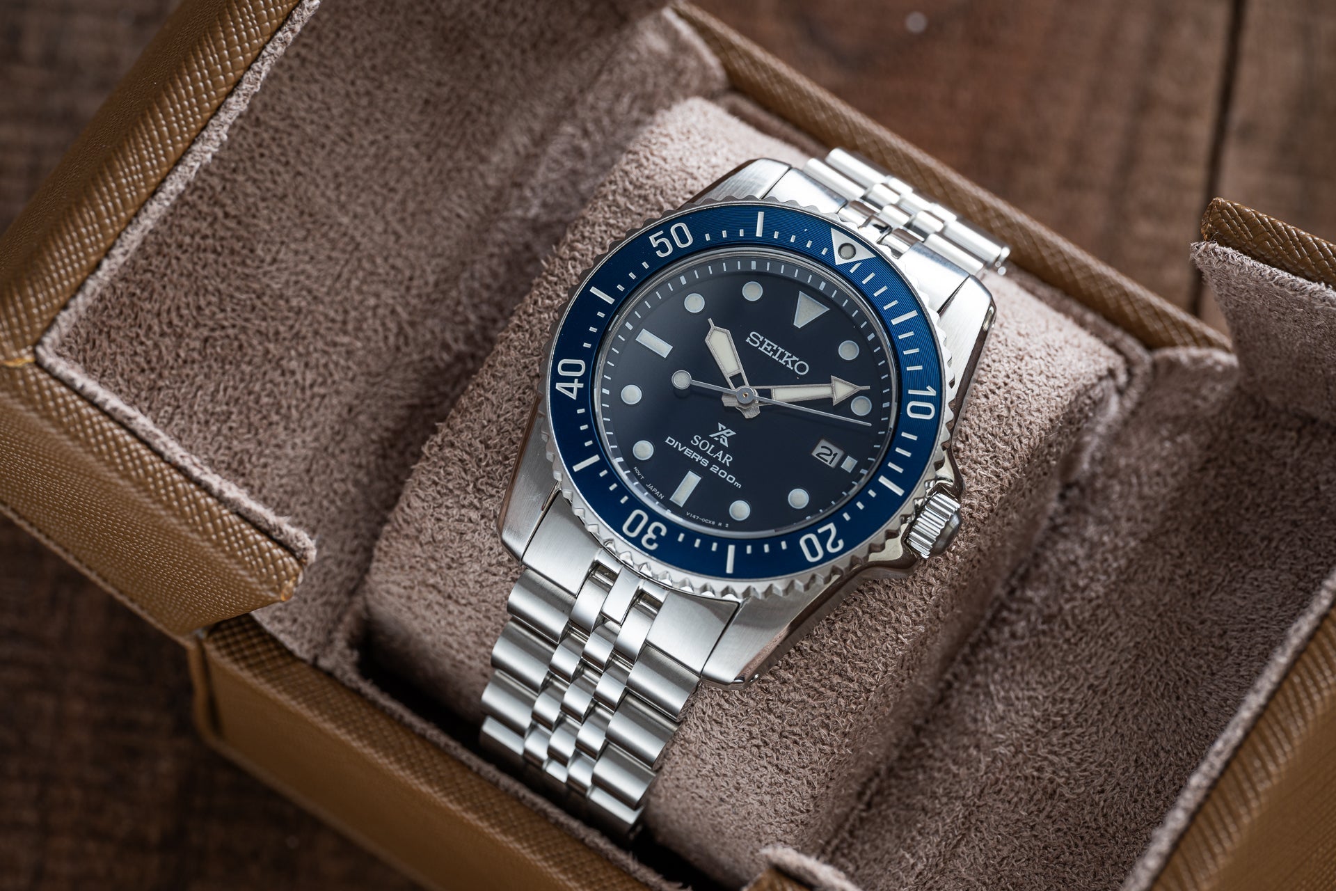 Seiko Prospex solar dive watch with blue bezel, black dial, and stainless steel bracelet in presentation box