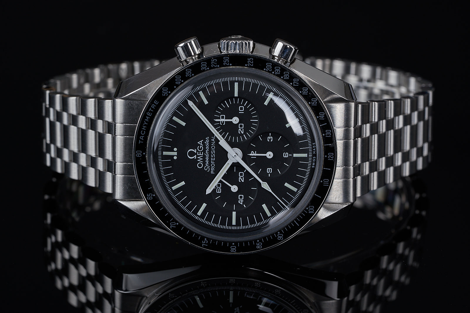 Omega Speedmaster Professional chronograph watch with black dial, tachymeter bezel, stainless steel bracelet on black background