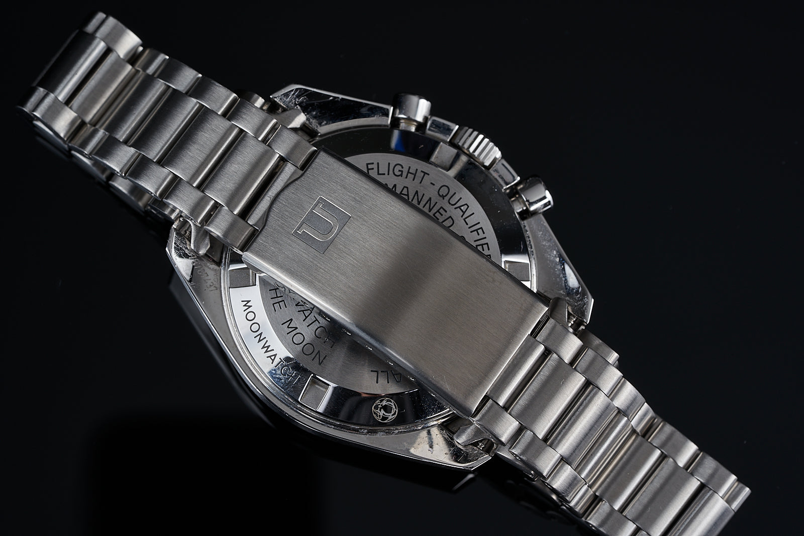 Stainless steel bracelet for Omega Speedmaster watch, 19/20mm lug width, three-link design shown on black background
