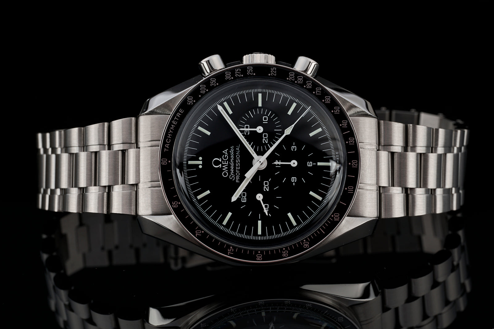 Omega Speedmaster chronograph watch with black dial, stainless steel bracelet, tachymeter bezel on black background