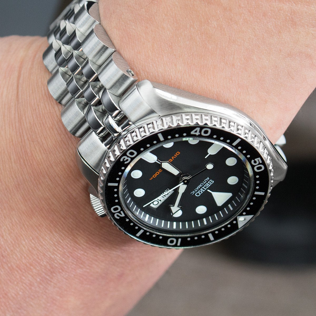 Strapcode Angus-J Louis Jubilee bracelet on Seiko SKX007 dive watch with black dial and steel link band