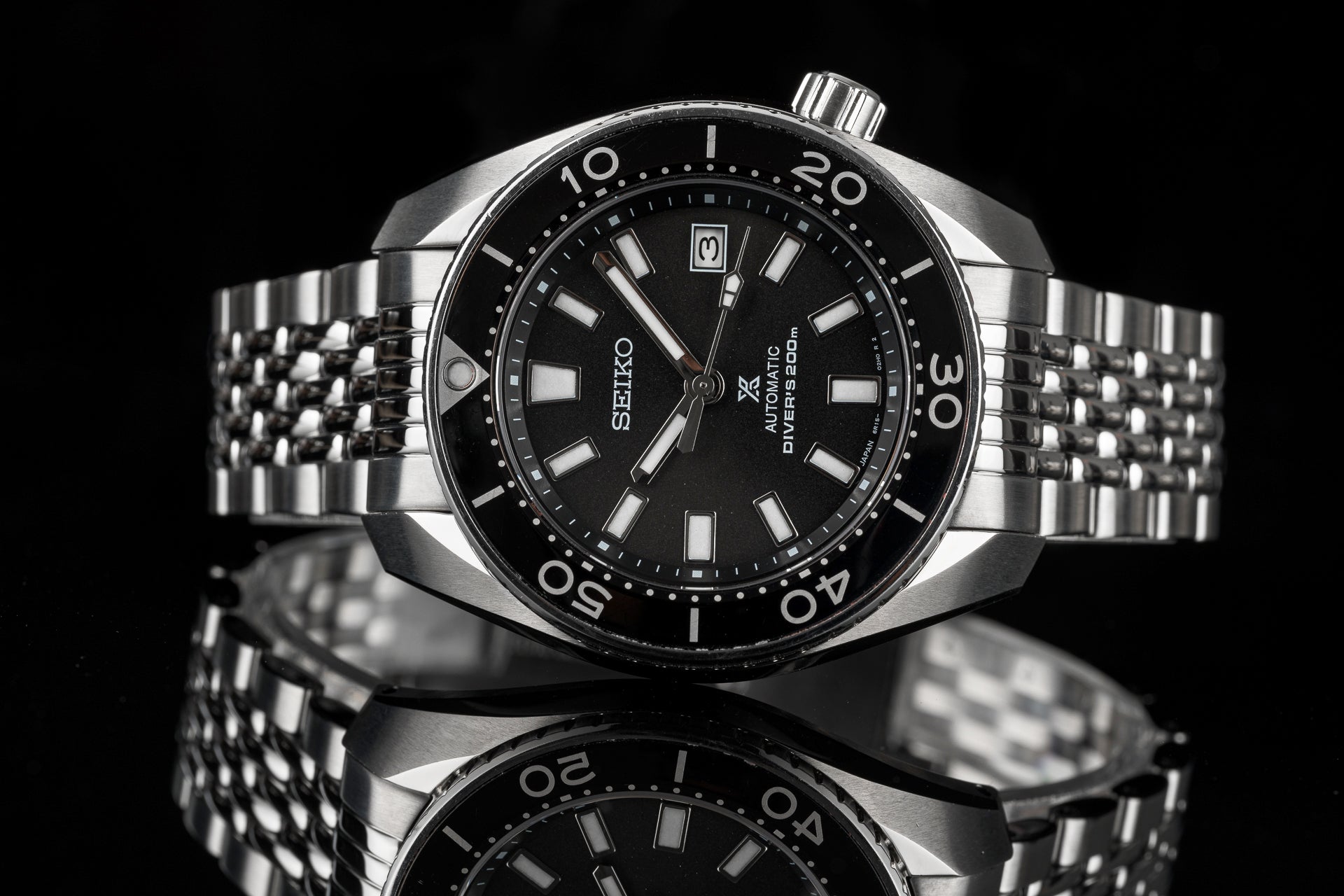 Seiko Sumo automatic diver watch with black dial, stainless steel beads of rice bracelet, and 200m water resistance