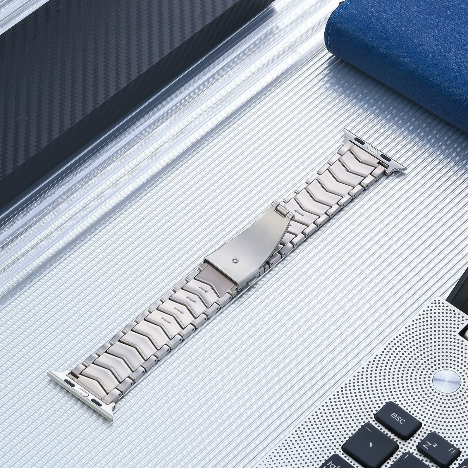 Titanium arched link bracelet for Apple Watch with polished silver finish and secure clasp closure