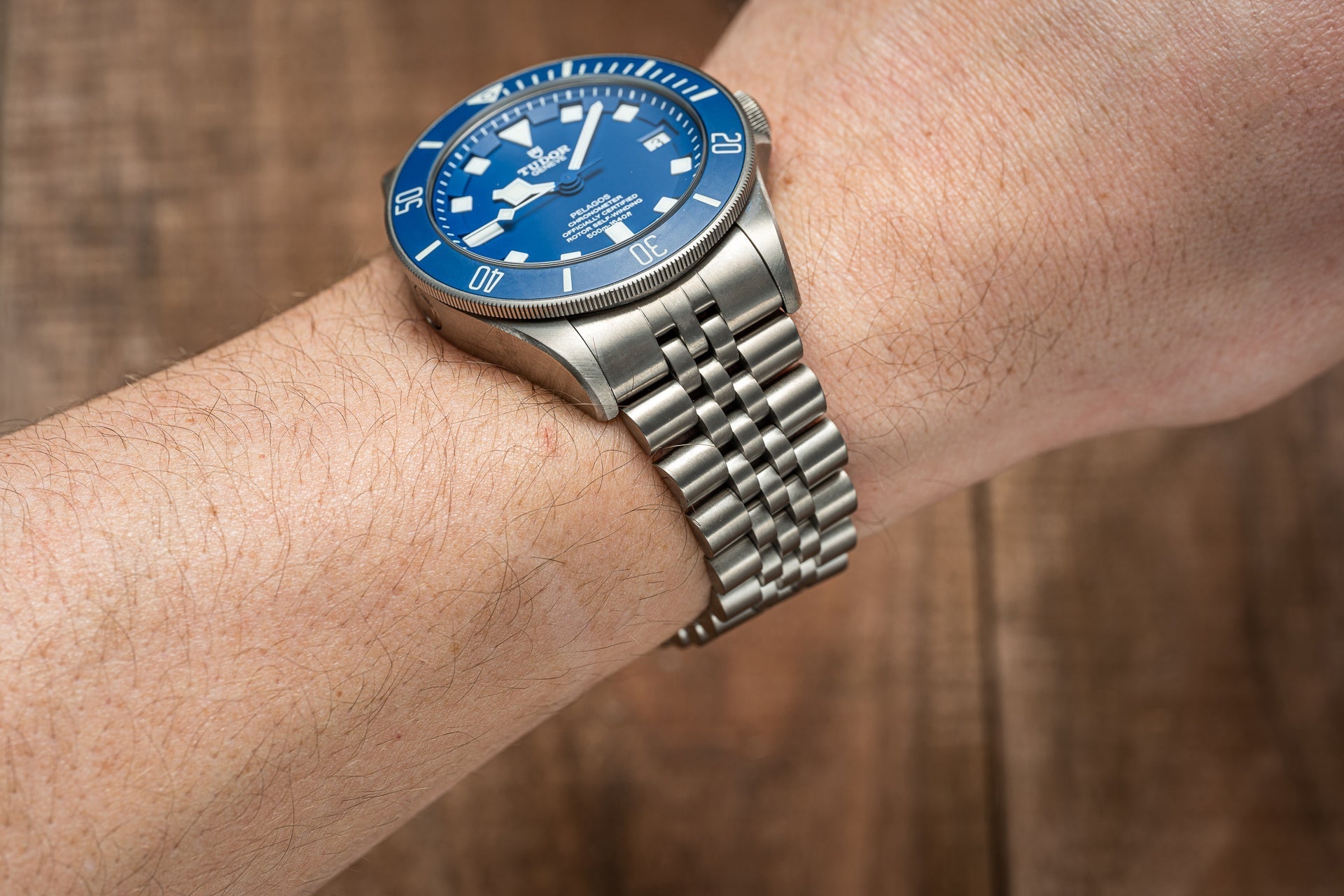 Stainless steel bracelet with secure clasp fitted on wrist, compatible with Tudor Pelagos 42mm dive watch