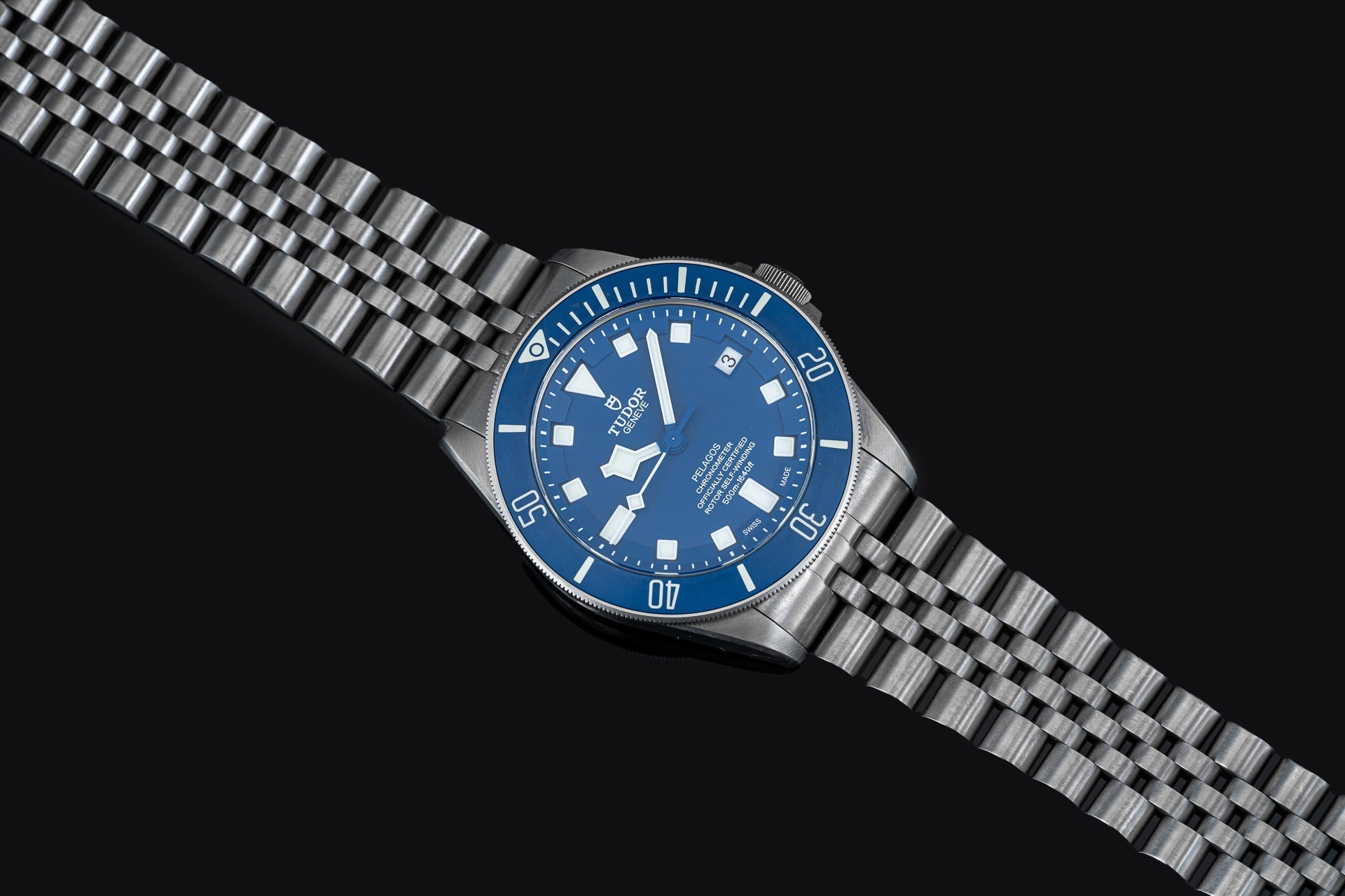 Titanium bracelet with solid link design and secure clasp for Tudor Pelagos 42mm dive watch on black background
