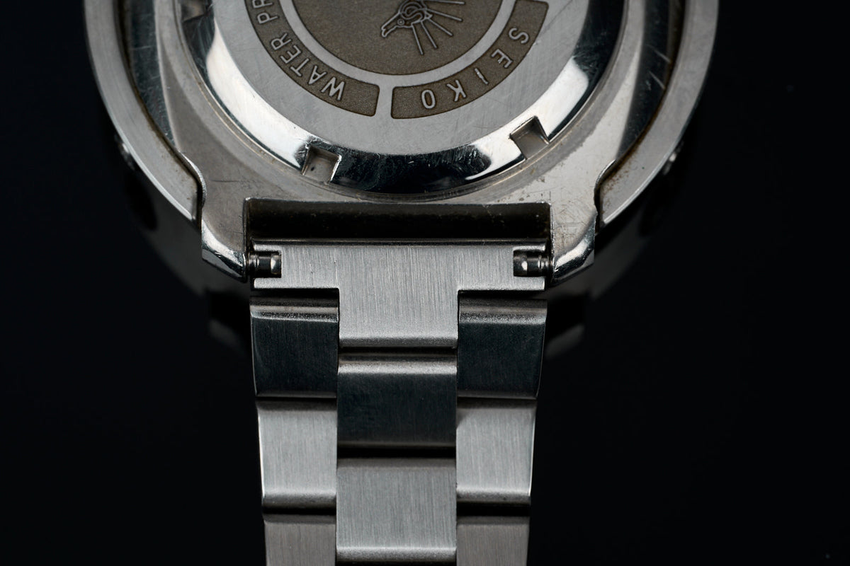 Stainless steel watch bracelet with straight end links, 22mm width, detailed overhead view showing metal construction