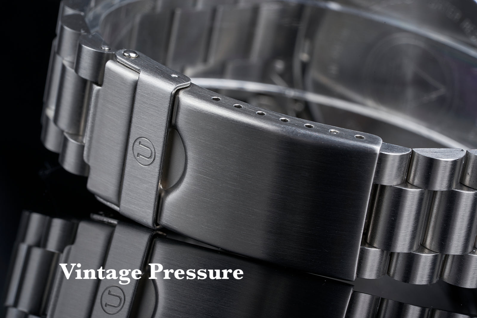 Stainless steel watch bracelet with fold-over clasp on Seiko SARB017, brushed metal finish with link detail