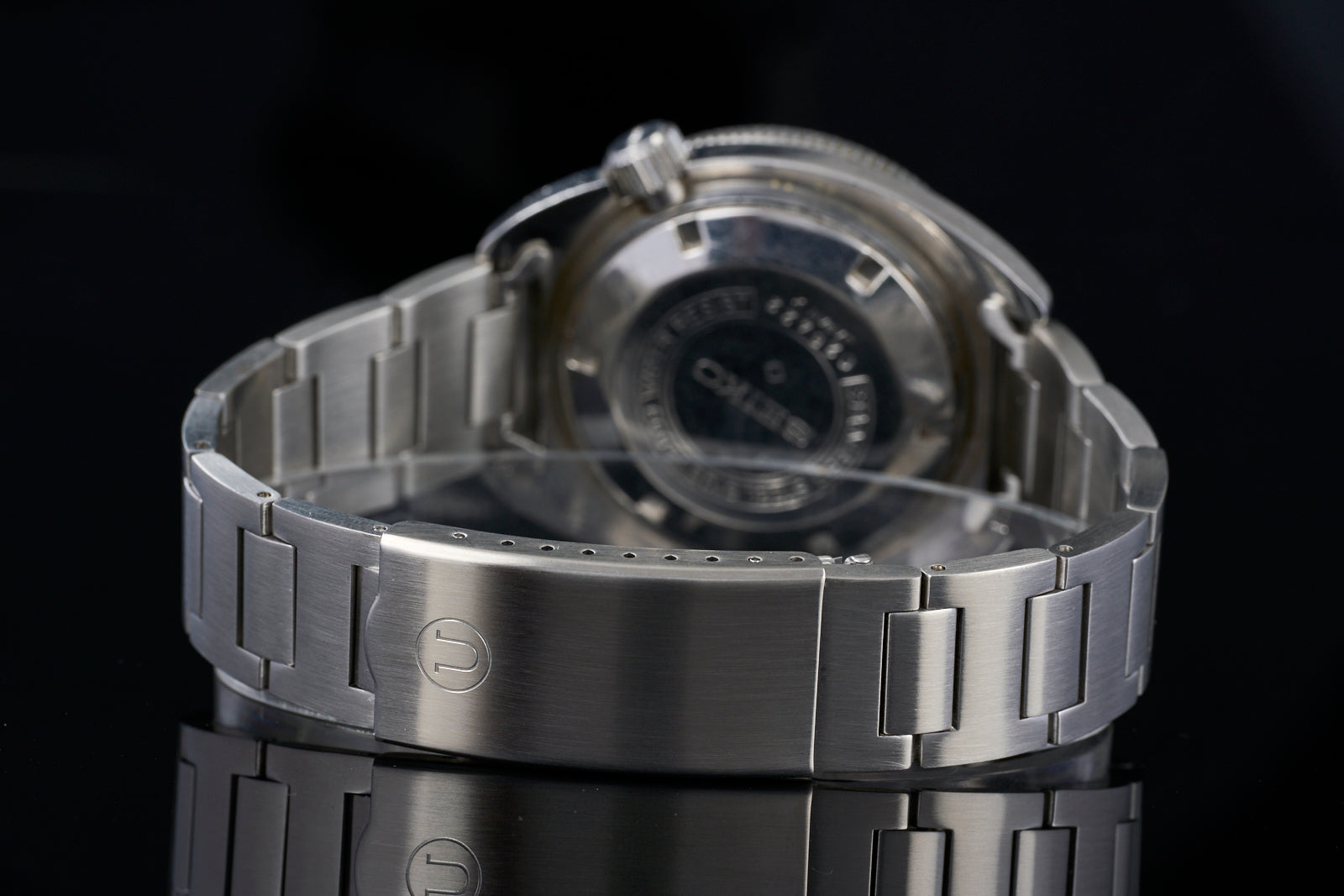Stainless steel H-Link bracelet for Seiko 6105 vintage watch, shown on black background