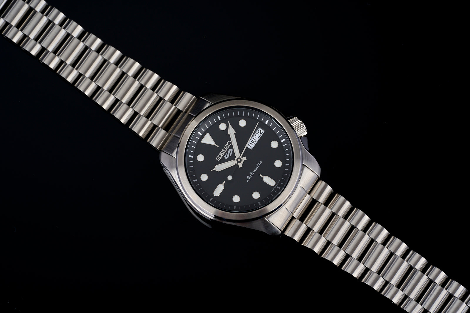 Seiko SRPE automatic diving watch with black dial, stainless steel bracelet and day-date window