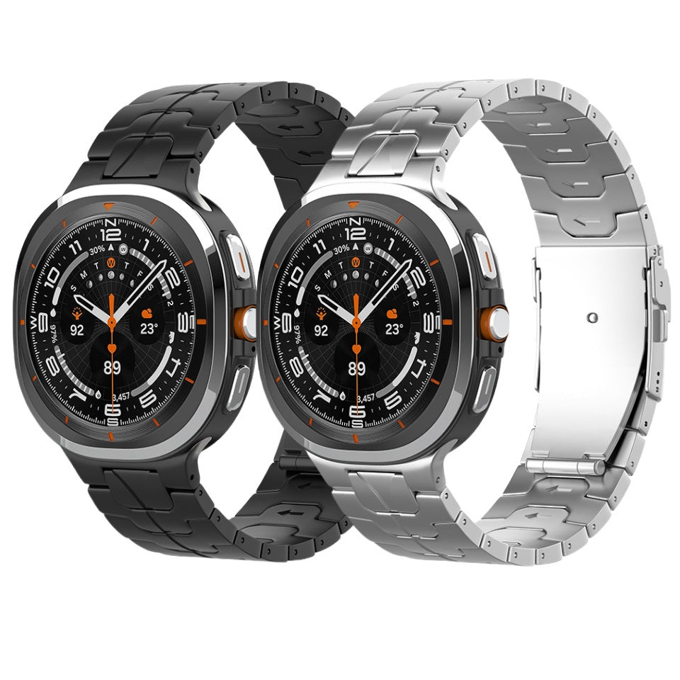 Rugged smartwatch with titanium armor bracelet in black and silver finishes, featuring bold digital display with orange accents