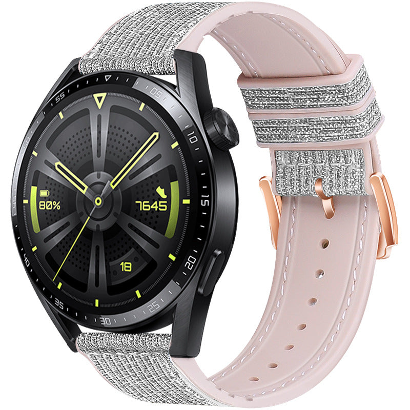 Black smartwatch with gray fabric band and pink leather quick release strap with sparkle details and rose gold buckle