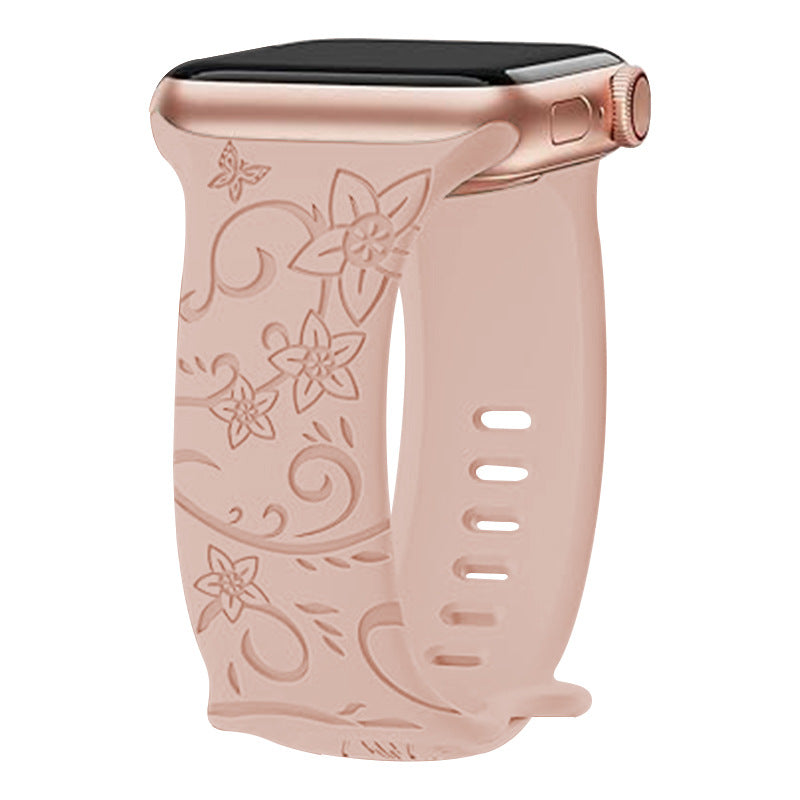 Rose gold silicone Apple Watch band with floral pattern design and adjustable strap