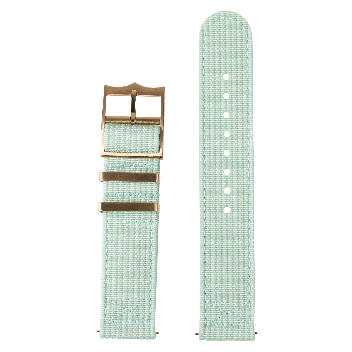 Light green canvas watch band with brass hardware and adjustment holes, displayed assembled and unassembled