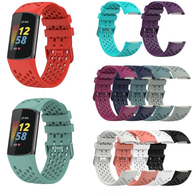 Fitbit Charge 5 and 6 fitness tracker with interchangeable perforated silicone bands in red, turquoise, purple, burgundy, navy, gray, white and black colors