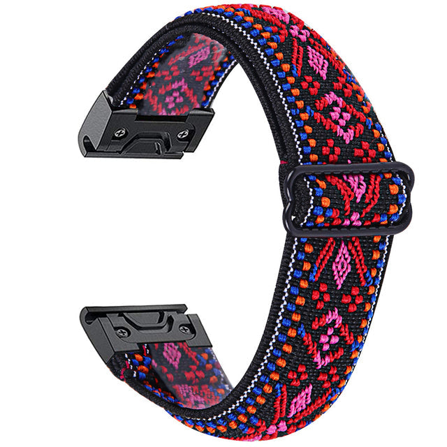 Colorful geometric woven watch band with red, pink, blue and orange pattern, black hardware and quick-fit connectors