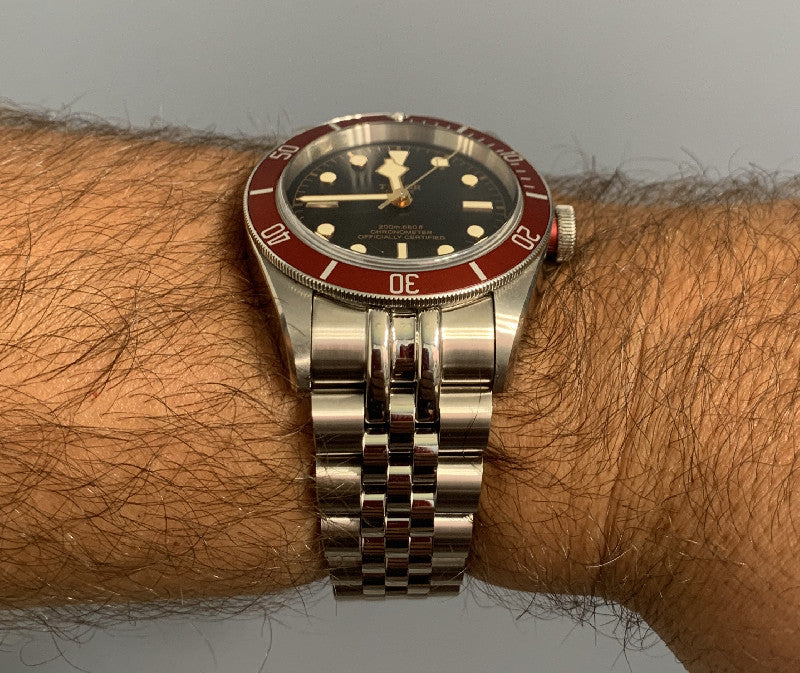 Stainless steel jubilee bracelet for Tudor Black Bay 41 watch on wrist, showing polished and brushed links with secure clasp