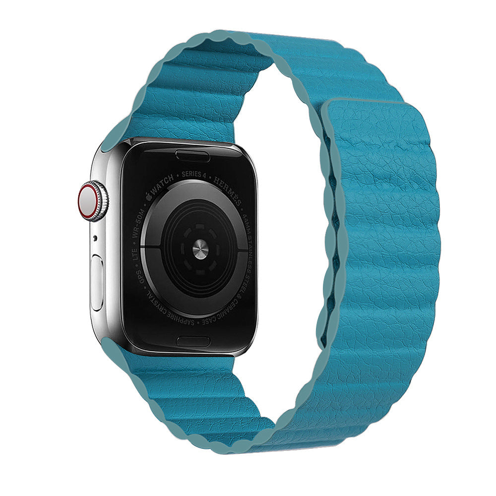 Silver stainless steel smartwatch Series 4 with turquoise leather loop band and red digital crown on white background