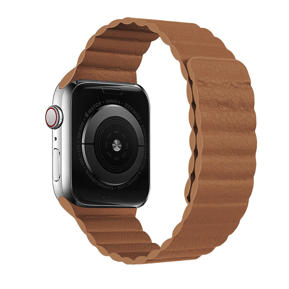 Silver Apple Watch Series 4 with tan brown leather loop band and red digital crown