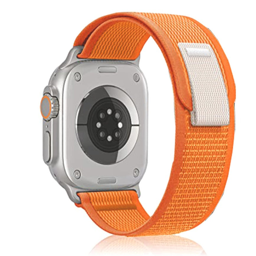Orange nylon trail loop band for Apple Watch with silver aluminum case and orange digital crown