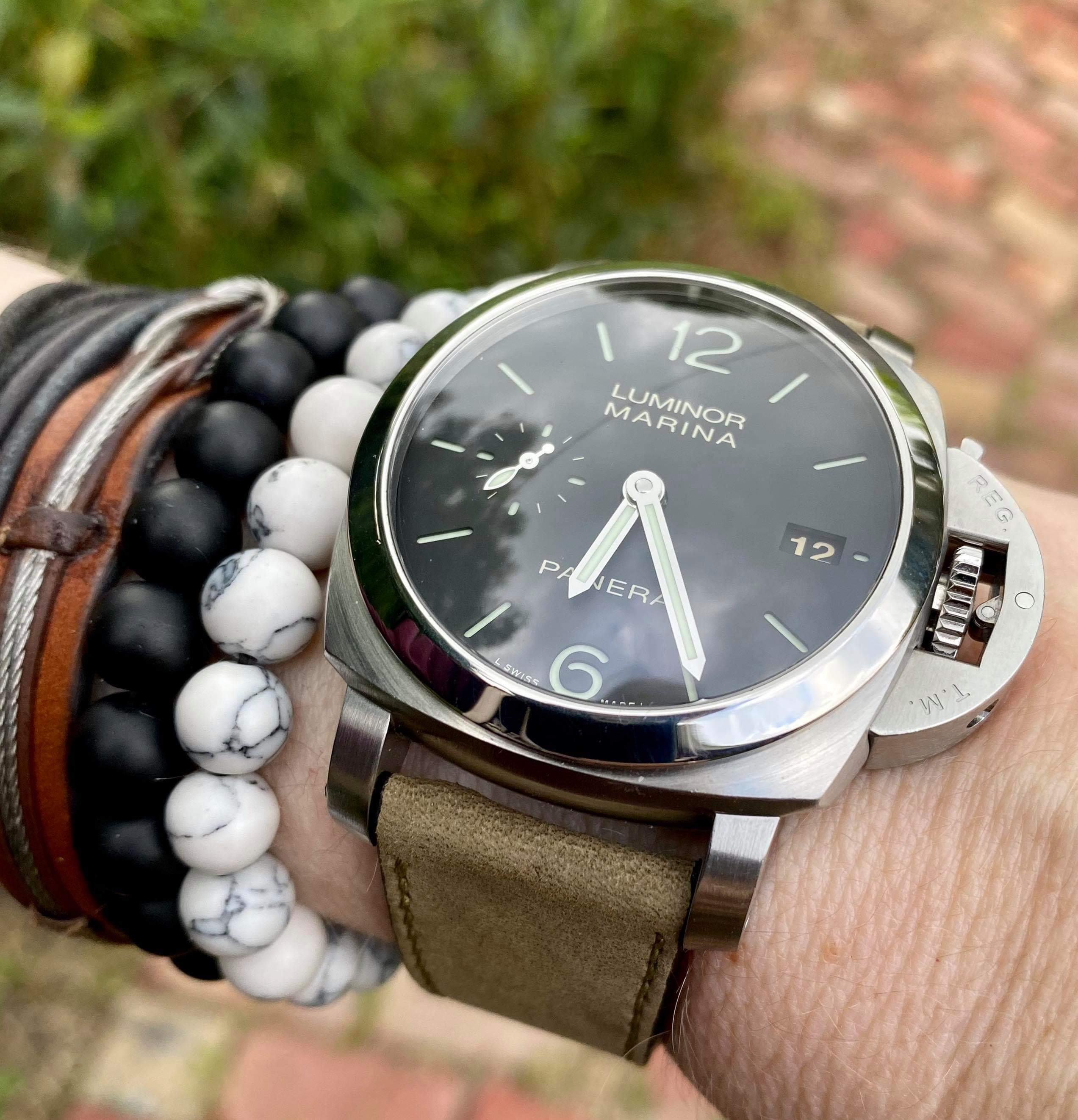 Luminor Marina stainless steel watch on olive green nubuck leather quick release strap