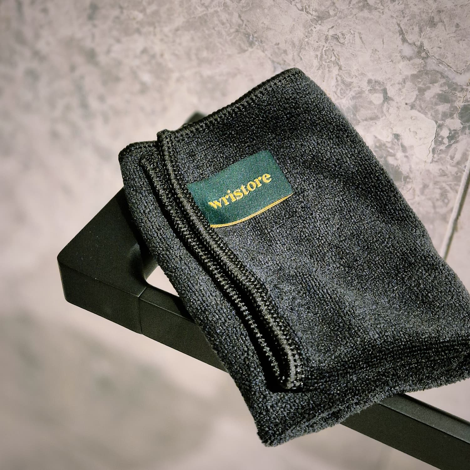 Wristore charcoal microfiber cleaning cloth with green and gold brand label on black packaging