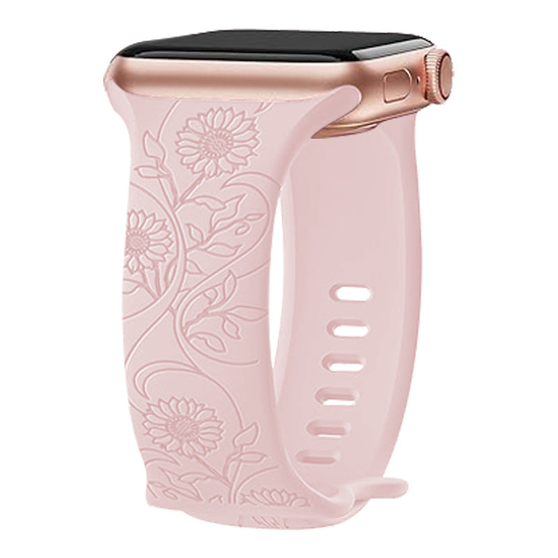 Rose gold smartwatch with pink floral silicone band featuring sunflower and leaf embossed design