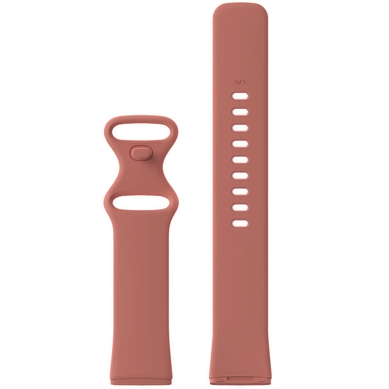 Dusty rose silicone watch band with perforated strap for Fitbit Versa and Sense smartwatches, featuring quick-release connector