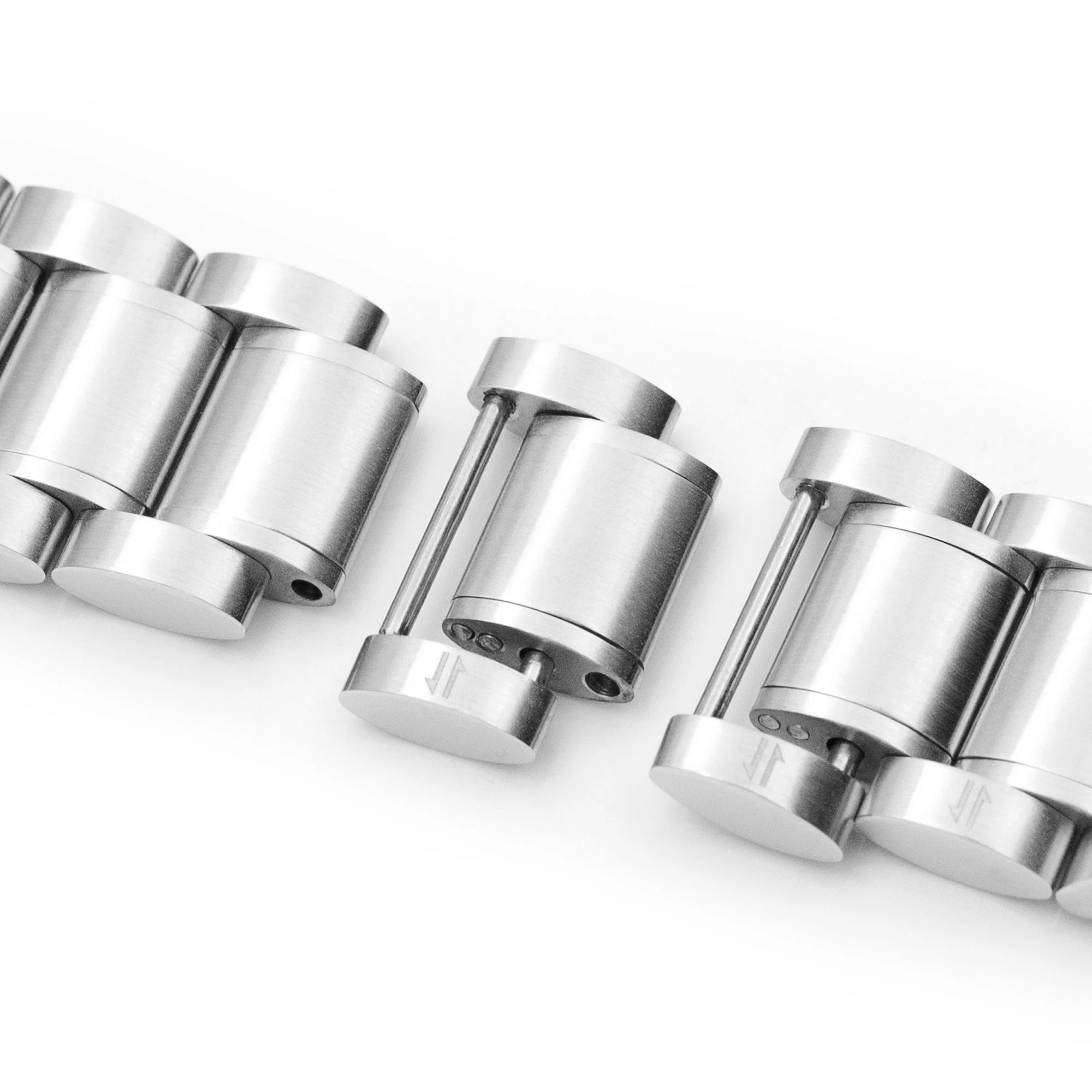 Strapcode Entwine stainless steel watch bracelet with V-clasp, polished metal links in side view