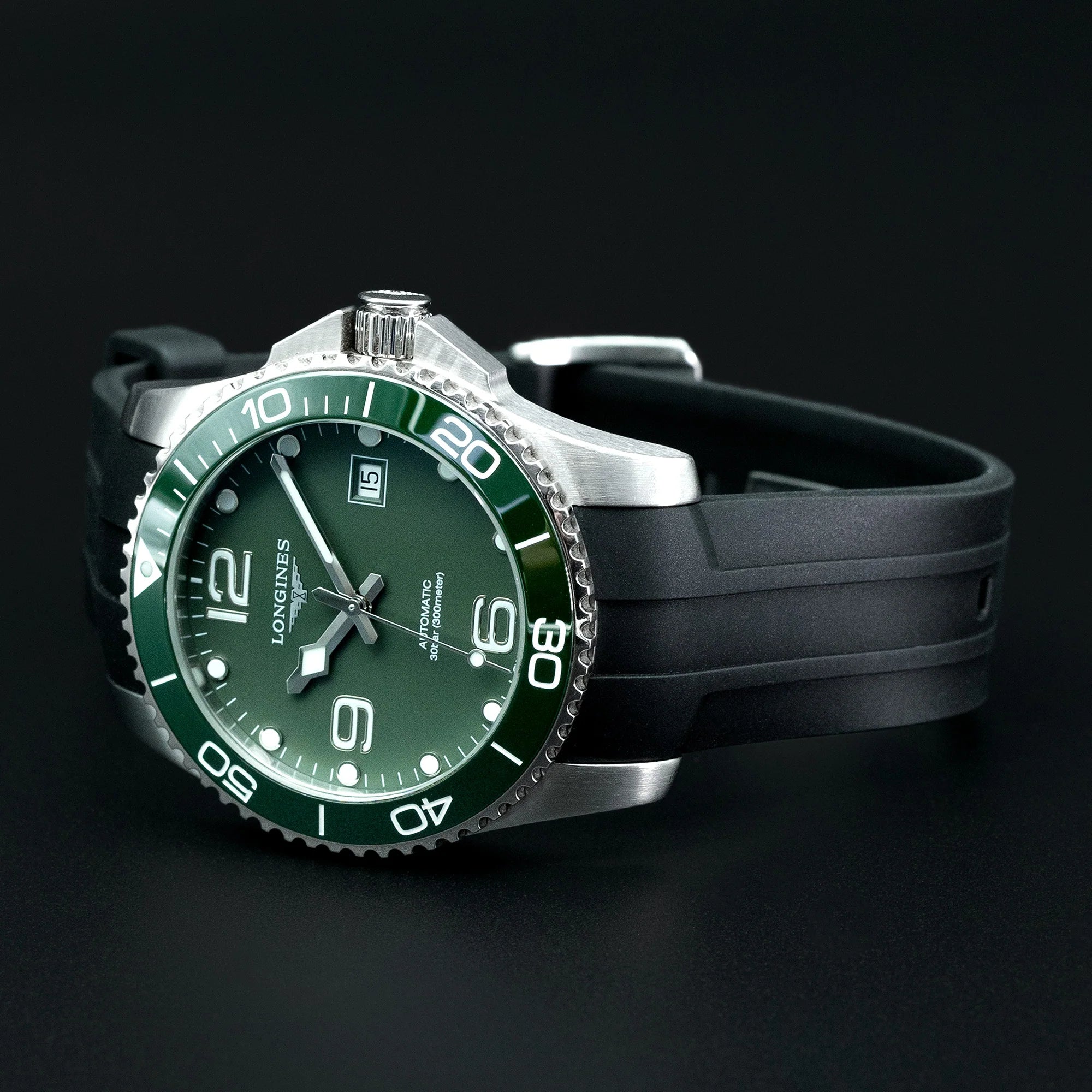 Longines HydroConquest dive watch with green dial and steel case on black curved FKM rubber strap with quick release system
