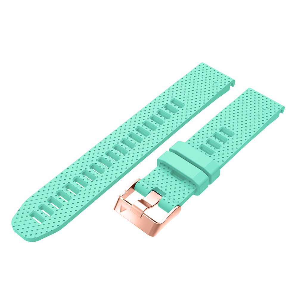 Mint green silicone smartwatch band with perforated design and rose gold quick-release buckle, shown as separate components