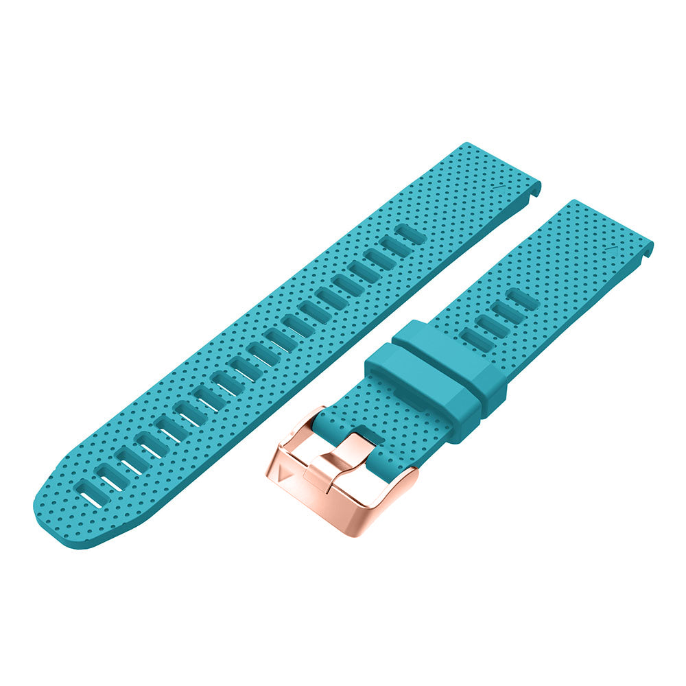 Turquoise silicone smartwatch band with rose gold buckle and quick-release pins, shown separated and connected