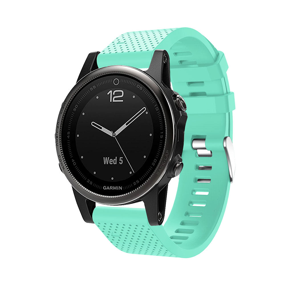 Garmin sports watch with black dial and mint green silicone QuickFit 20mm band with silver hardware