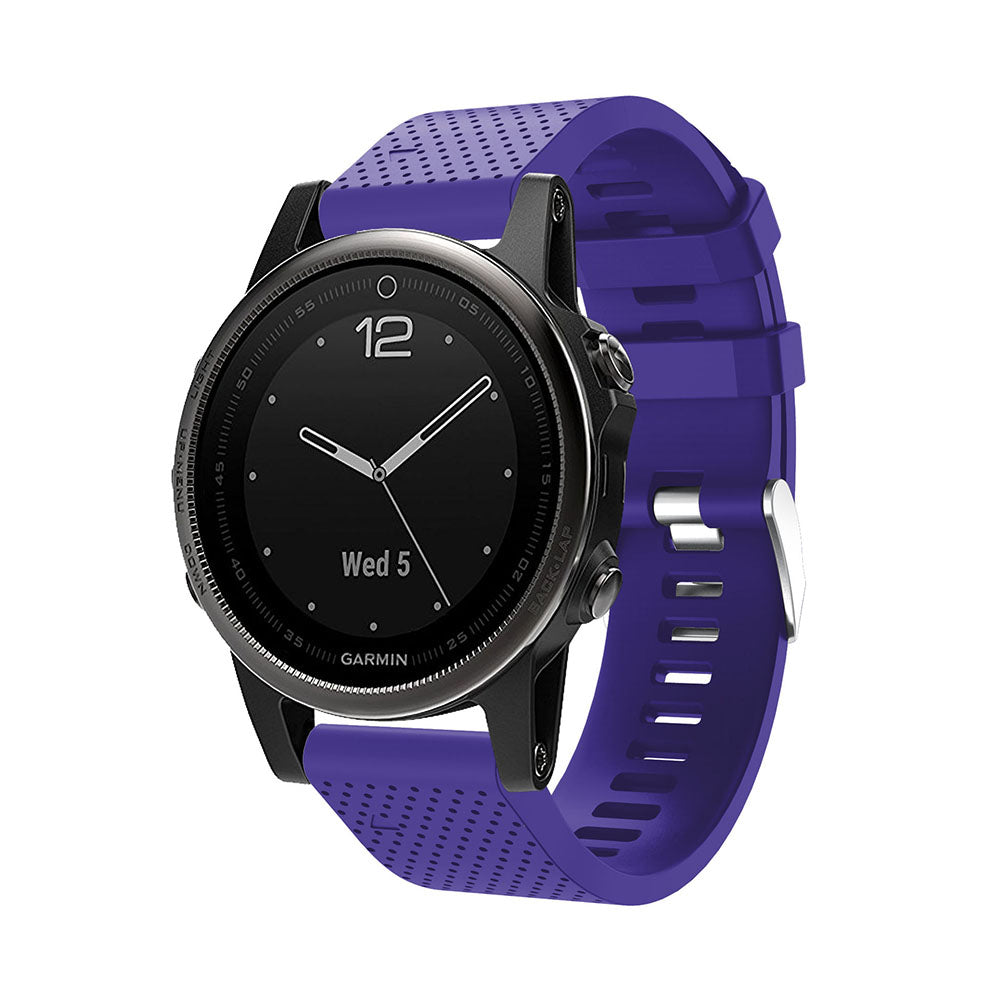 Garmin smartwatch with black dial and purple silicone QuickFit 20mm band featuring silver hardware buckle