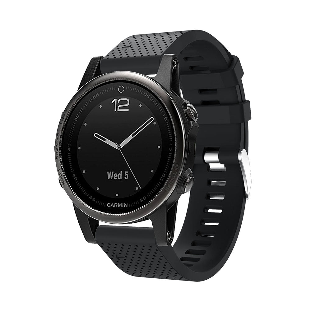 Garmin smartwatch with black silicone QuickFit 20mm band and silver hardware, displaying date and time on dark dial