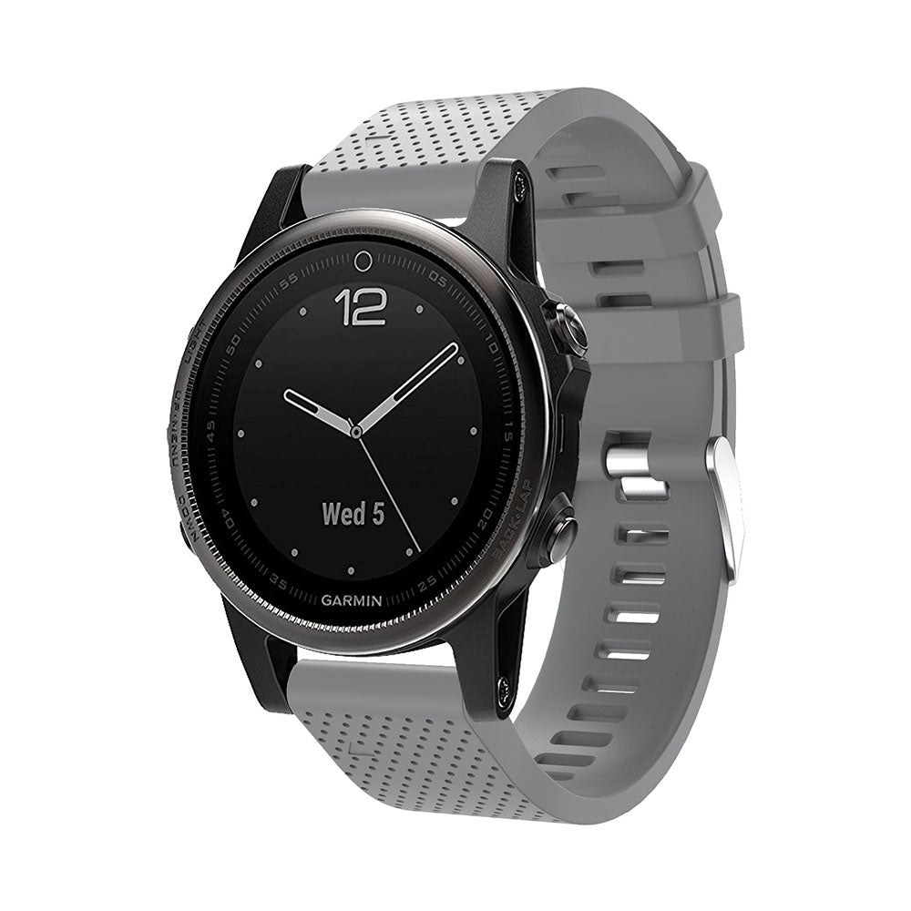 Garmin smartwatch with black dial and gray silicone band featuring QuickFit 20mm connector and silver hardware