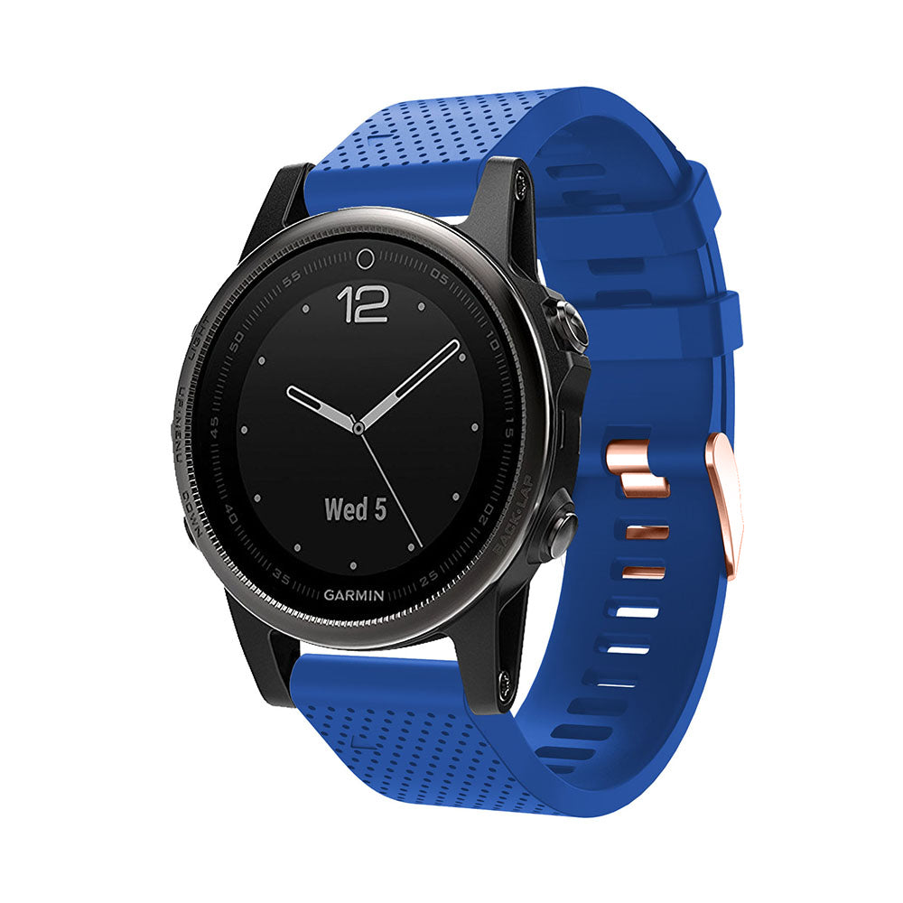 Garmin smartwatch with black dial and blue silicone QuickFit band featuring rose gold hardware buckle