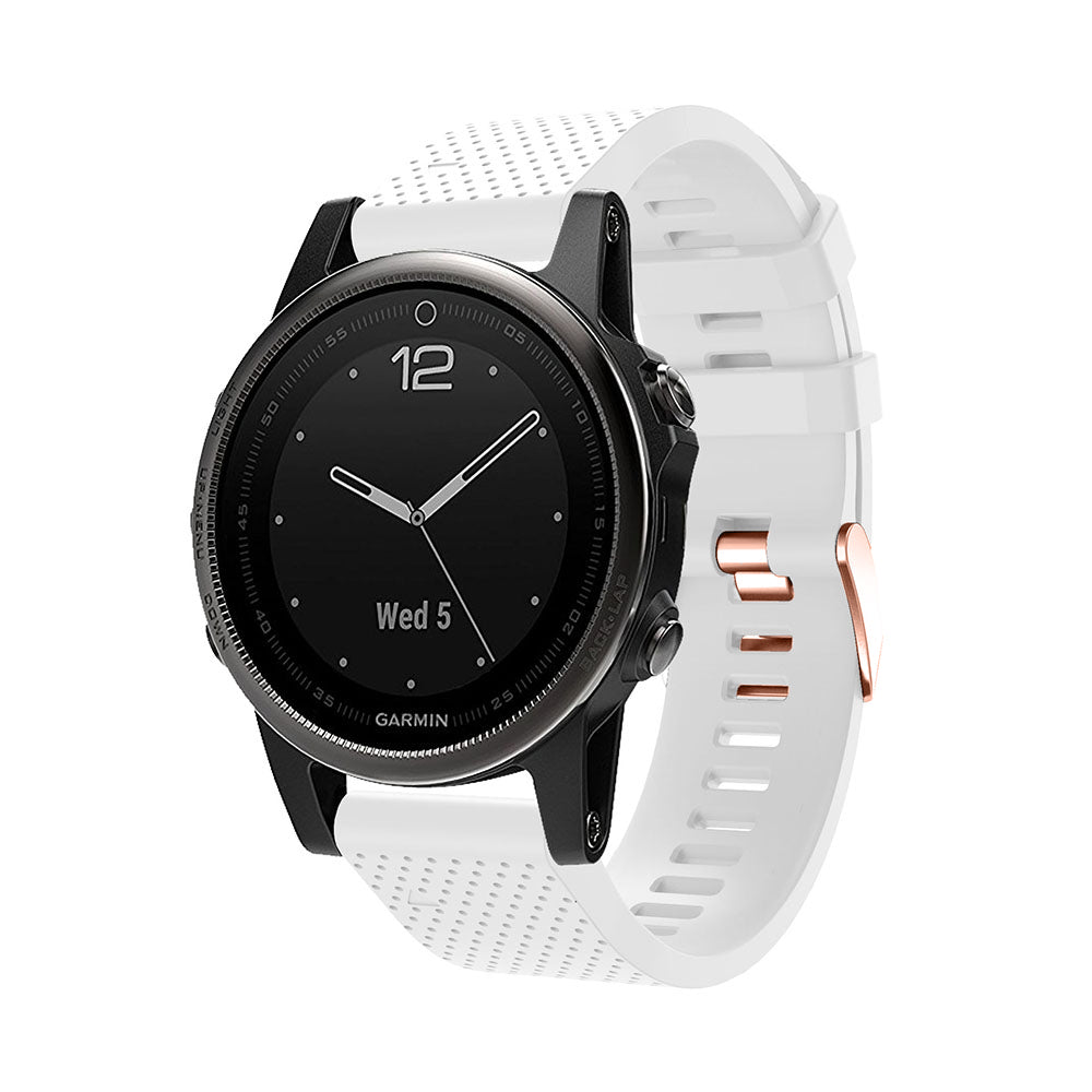 Garmin smartwatch with black dial and white silicone QuickFit band featuring rose gold hardware and buckle