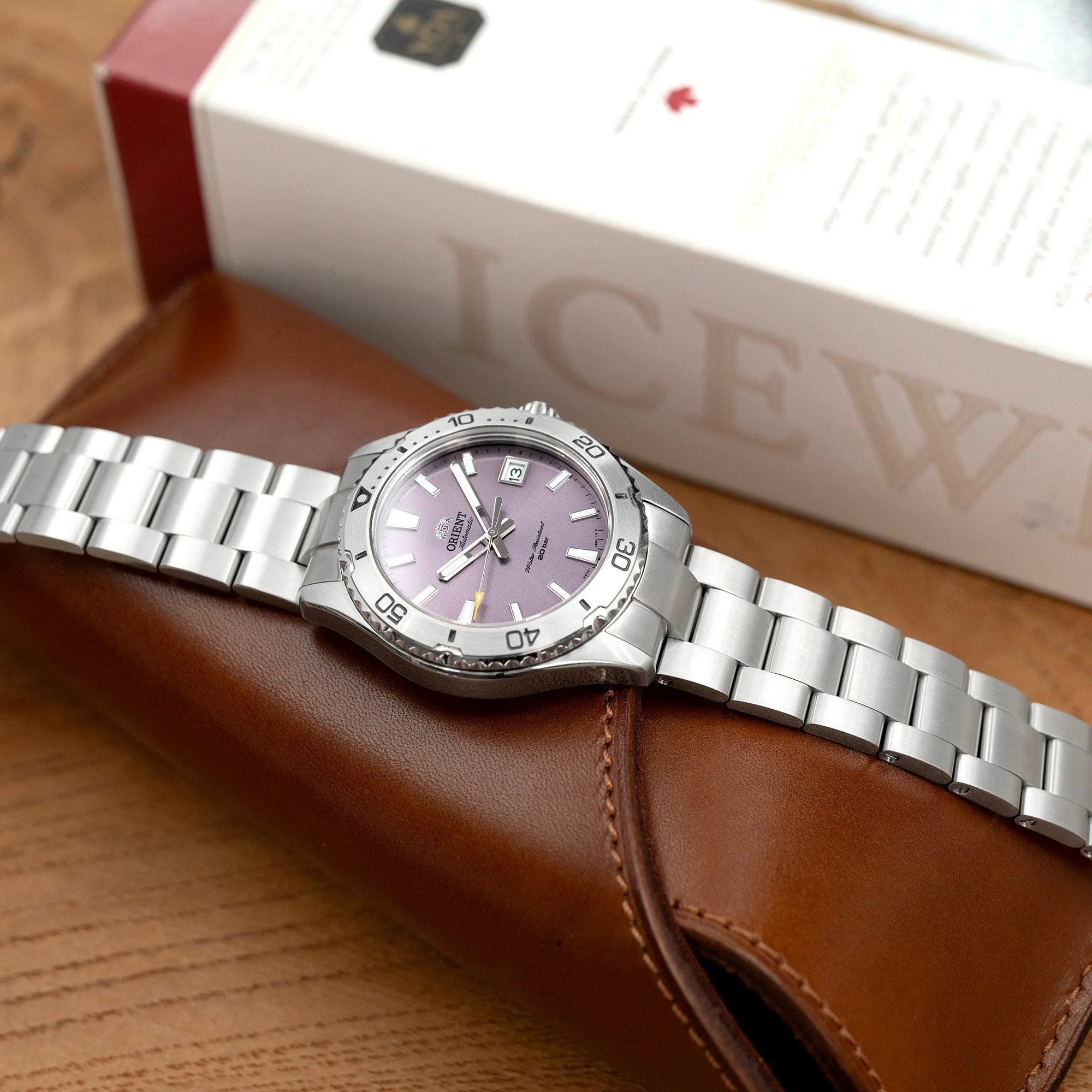 Strapcode Super-O Boyer stainless steel watch band with solid end links on Orient Mako 40 timepiece featuring purple dial