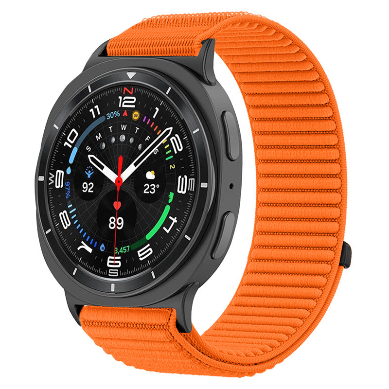 Black smartwatch with orange sports loop band, displaying colorful fitness metrics and time on digital face
