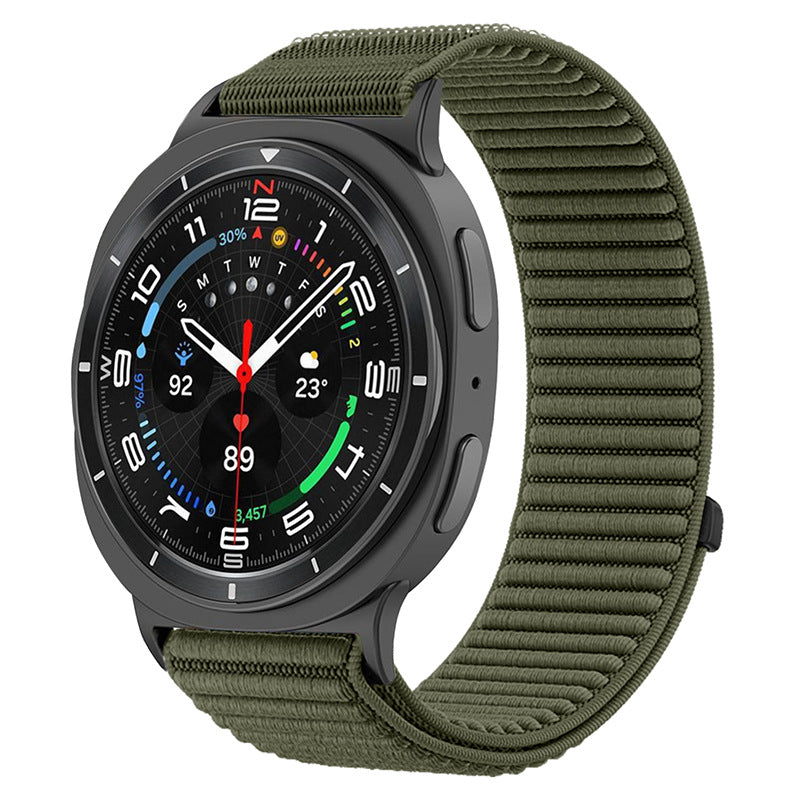 Black smartwatch with olive green sports loop band displaying colorful watch face with time, weather, and fitness data